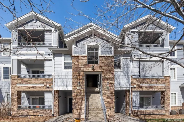 a front view of a house with a garage