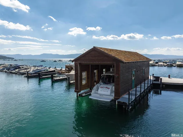 a view of a lush green forest with a houses