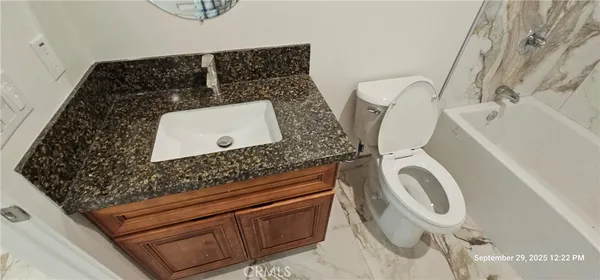 a bathroom with a toilet and a sink