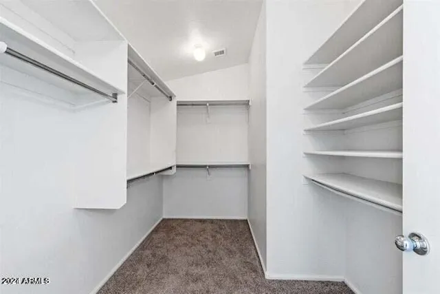 a view of a brick house with a balcony