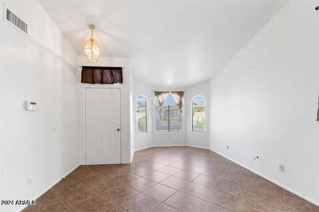 a kitchen with stainless steel appliances granite countertop a sink and stove