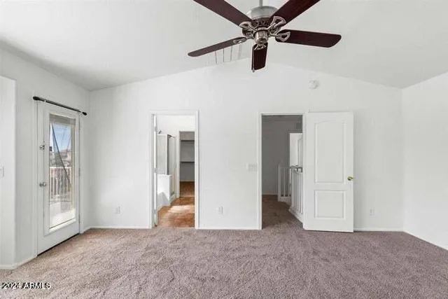 a bathroom with a double vanity sink toilet and shower