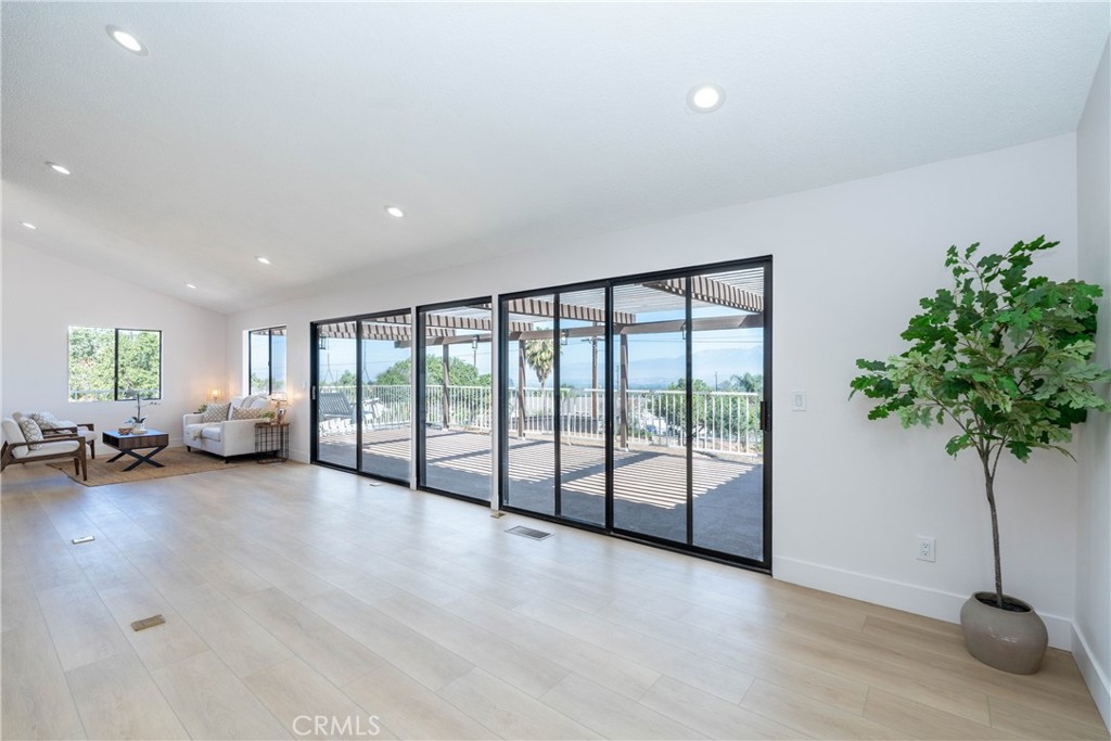 16066 Rancho Verde Circle Riverside, CA 92506 - Photo 11 of 29 a view of a room with gym equipment and a large window