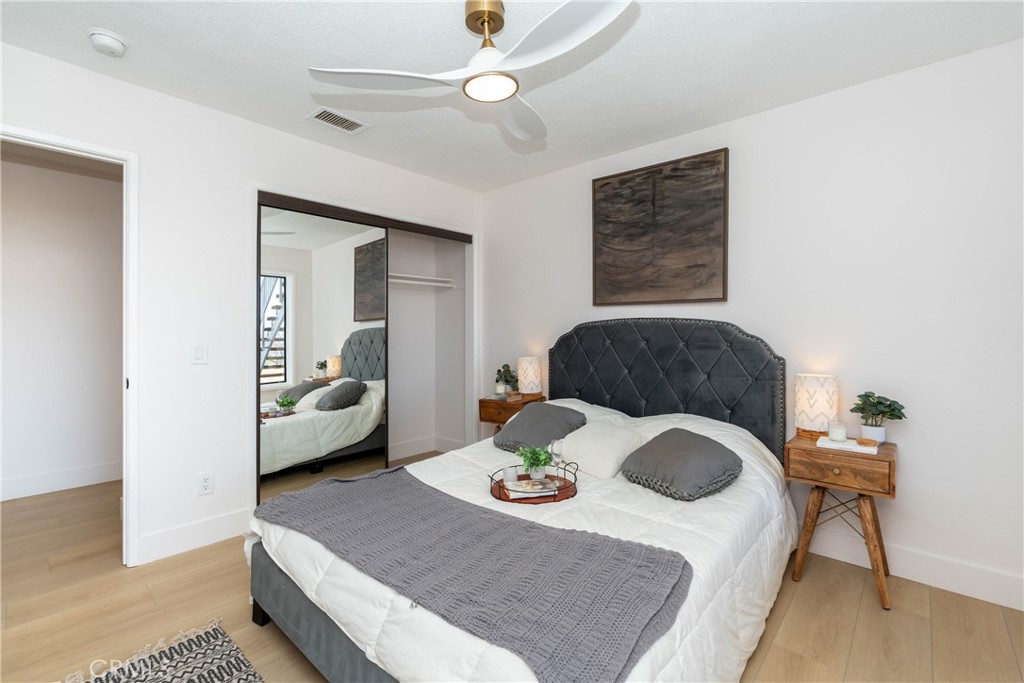 16066 Rancho Verde Circle Riverside, CA 92506 - Photo 19 of 29 a living room with a couch and a chandelier