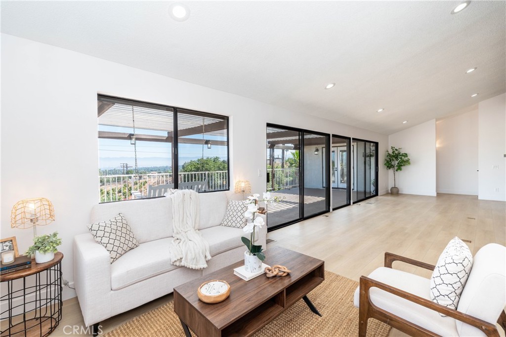 16066 Rancho Verde Circle Riverside, CA 92506 - Photo 6 of 29 a living room with furniture and a large window