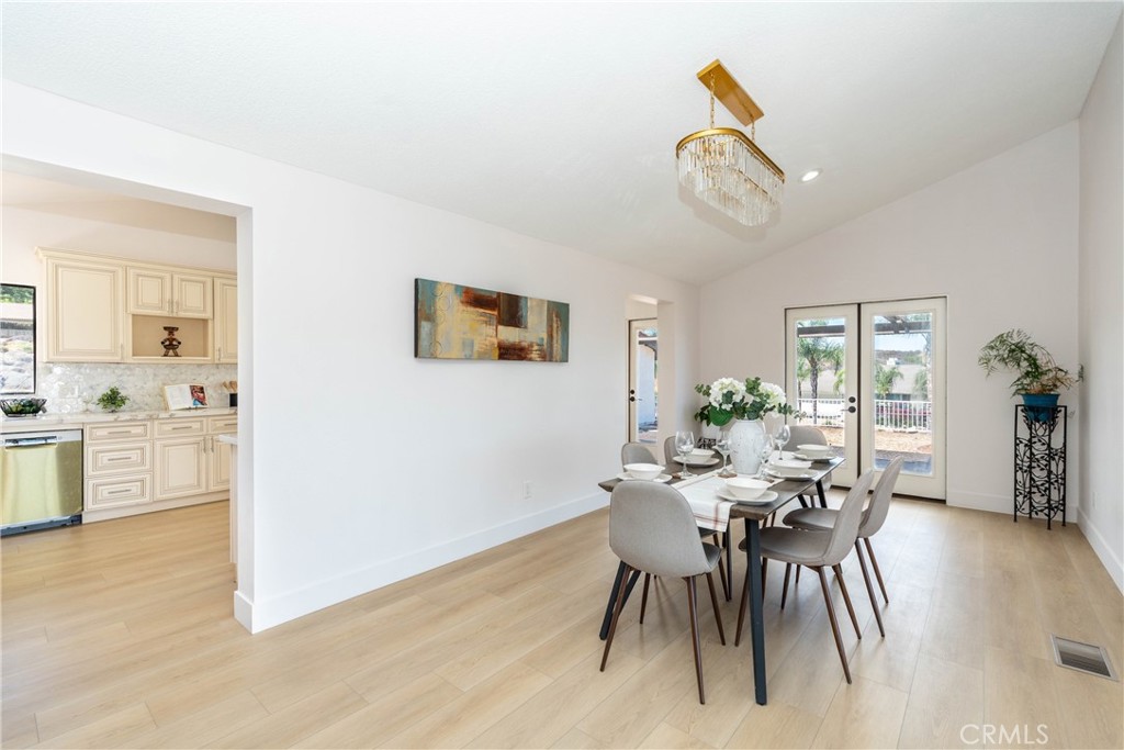 16066 Rancho Verde Circle Riverside, CA 92506 - Photo 8 of 29 a view of a dining room with furniture and wooden floor