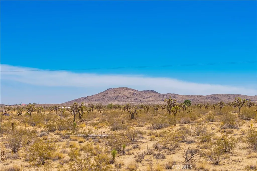 0 Stearman Road Landers, CA 92285 - Photo 18 of 27 a view of a mountain range in a cloudy sky