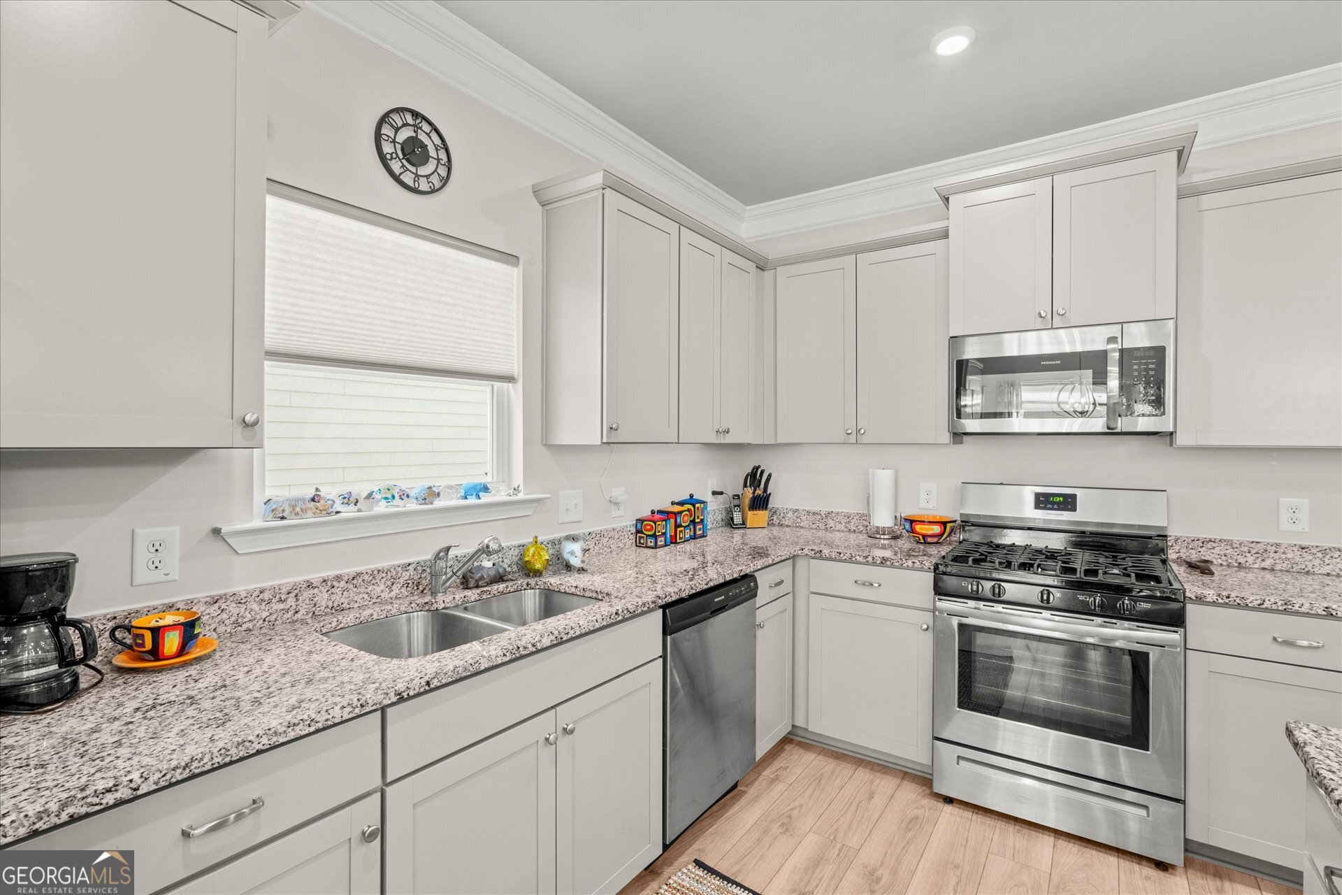 60 Light Lane Oxford, AL 36203 - Photo 14 of 45 a kitchen with granite countertop white cabinets sink and stainless steel appliances