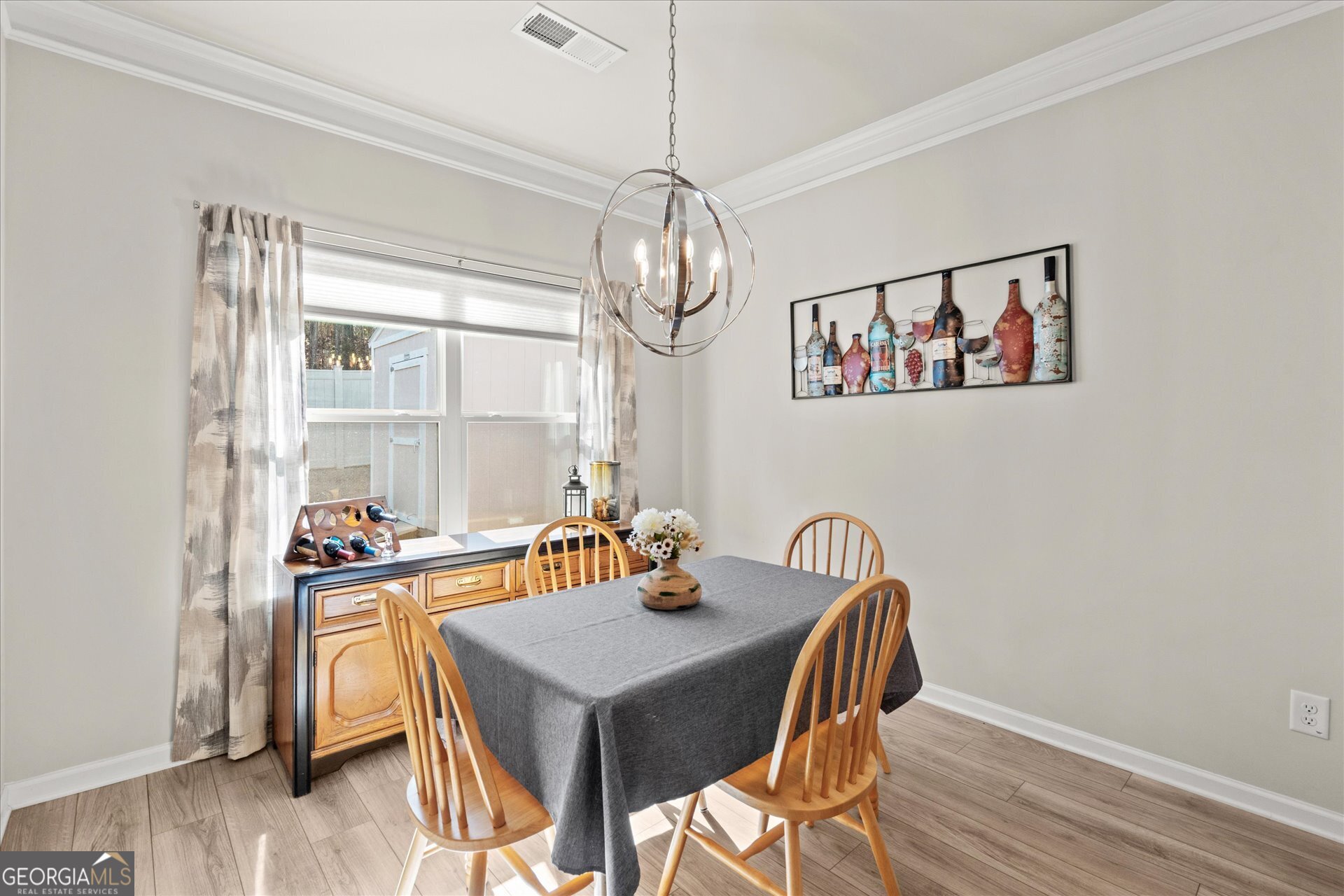 60 Light Lane Oxford, AL 36203 - Photo 17 of 45 a view of a dining room with furniture wooden floor and a chandelier