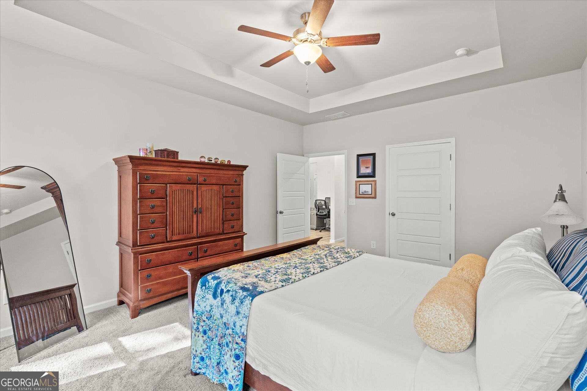 60 Light Lane Oxford, AL 36203 - Photo 21 of 45 a bedroom with a bed and dresser with mirror