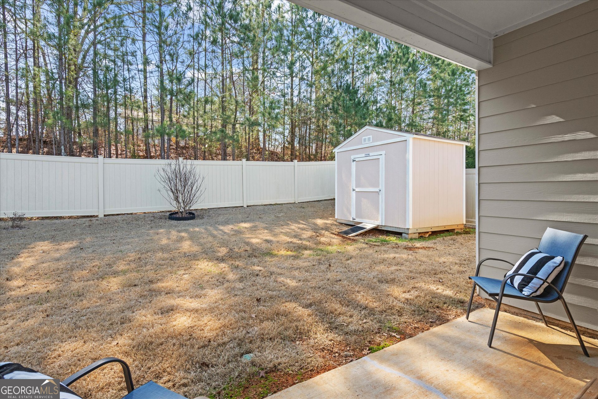 60 Light Lane Oxford, AL 36203 - Photo 35 of 45 a view of a backyard with a large tree and wooden fence