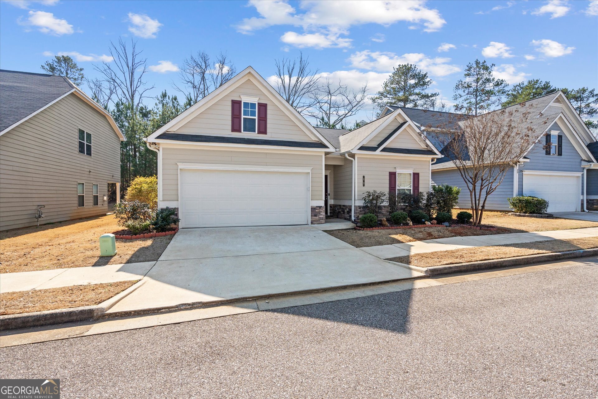 60 Light Lane Oxford, AL 36203 - Photo 43 of 45 a view of a white house with a fountain and large tree