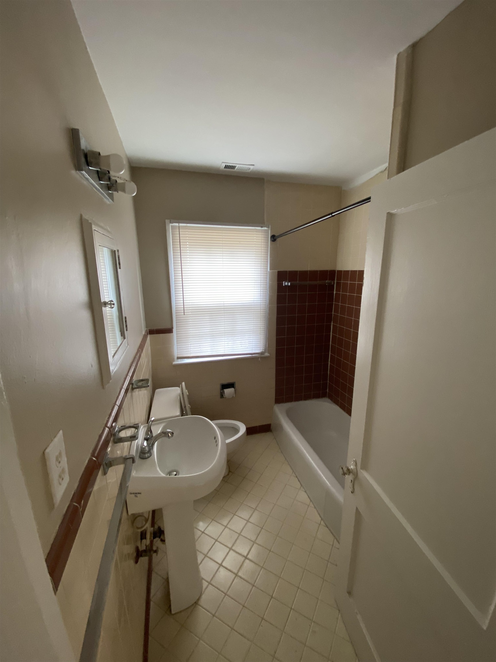 648 Loeb Street Memphis, TN 38111 - Photo 11 of 18 a bathroom with a sink toilet and shower