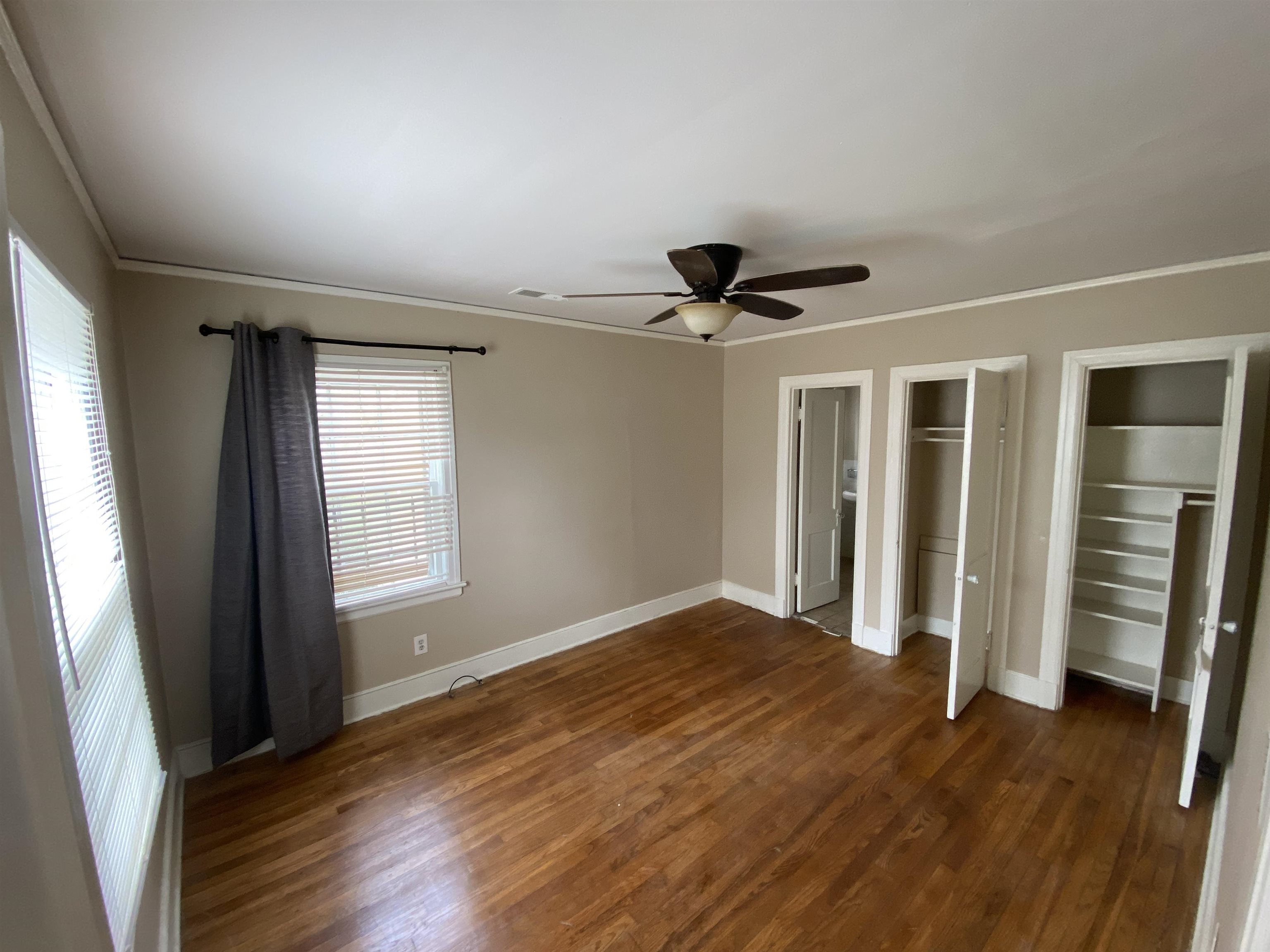 648 Loeb Street Memphis, TN 38111 - Photo 14 of 18 a view of empty room with wooden floor and fan