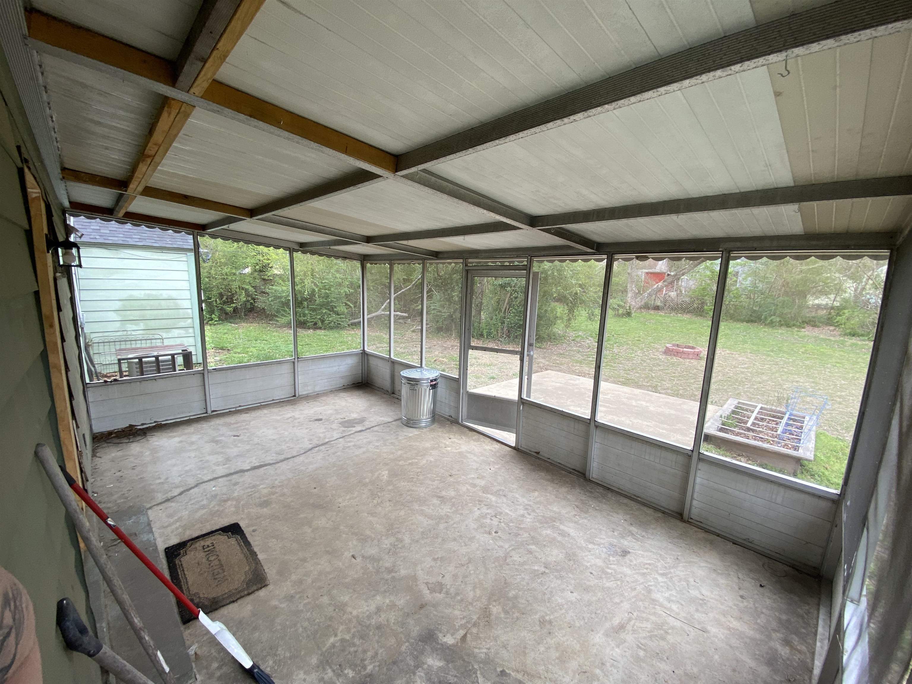 648 Loeb Street Memphis, TN 38111 - Photo 15 of 18 a view of an empty room with wooden floor and a balcony
