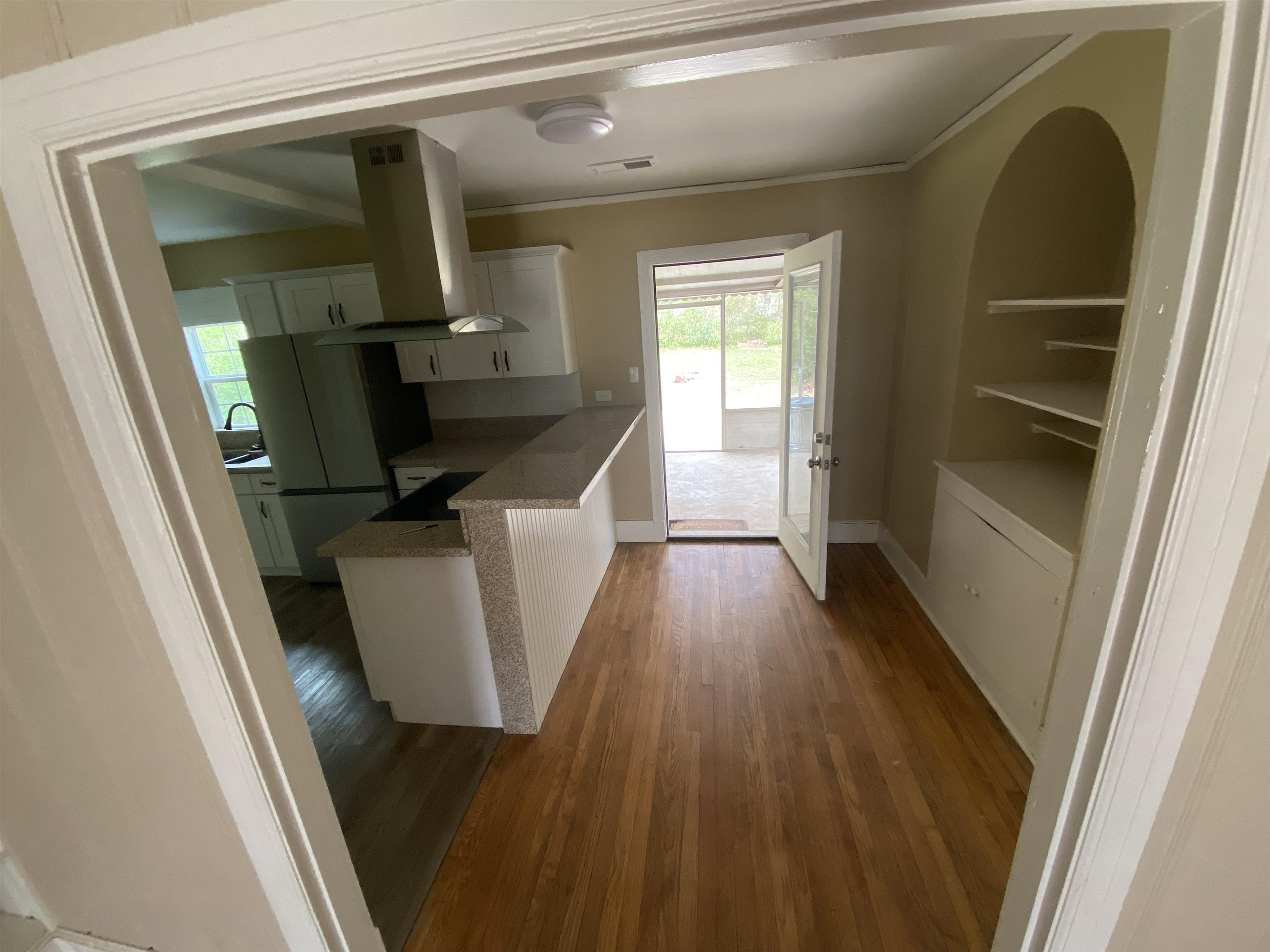 648 Loeb Street Memphis, TN 38111 - Photo 4 of 18 a view of hallway with wooden floor and staircase
