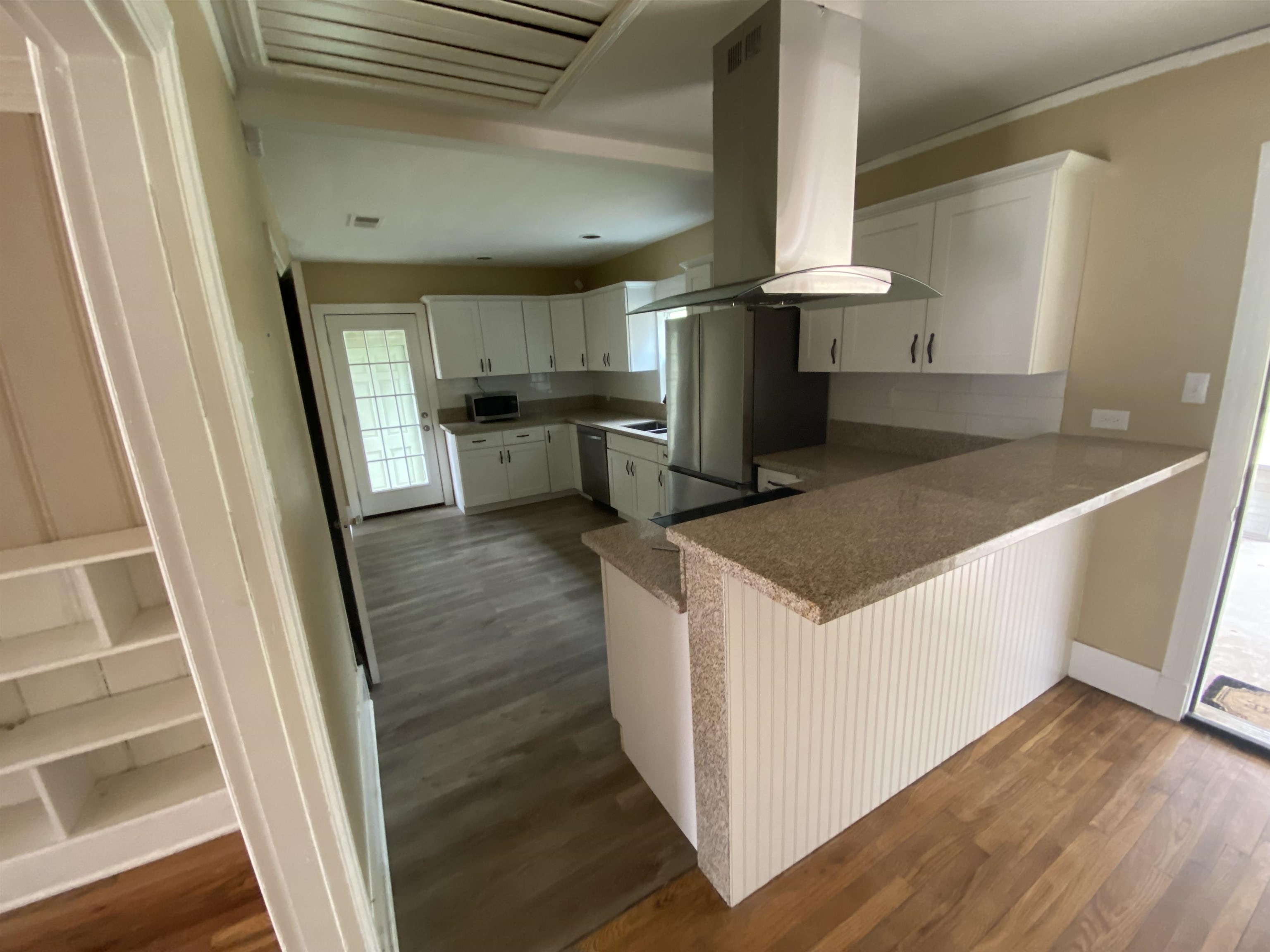 648 Loeb Street Memphis, TN 38111 - Photo 5 of 18 a kitchen with a refrigerator a sink and cabinets