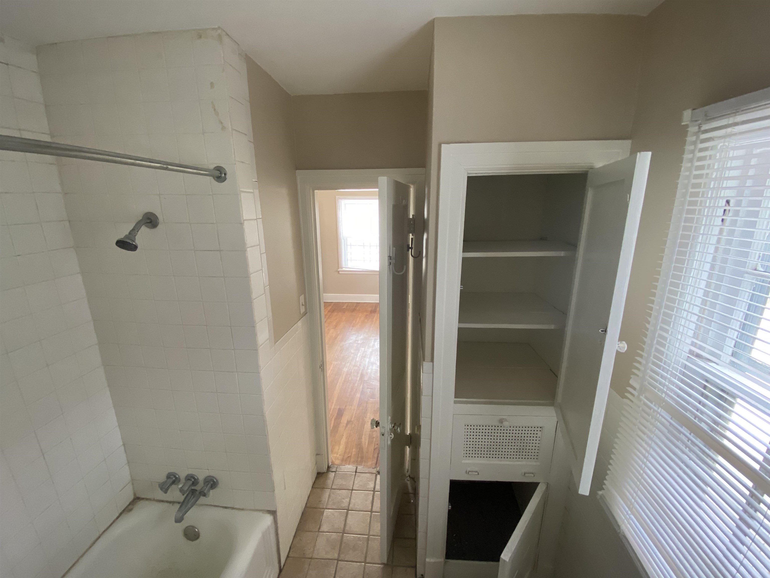 648 Loeb Street Memphis, TN 38111 - Photo 9 of 18 a bathroom with a bathtub and a shower