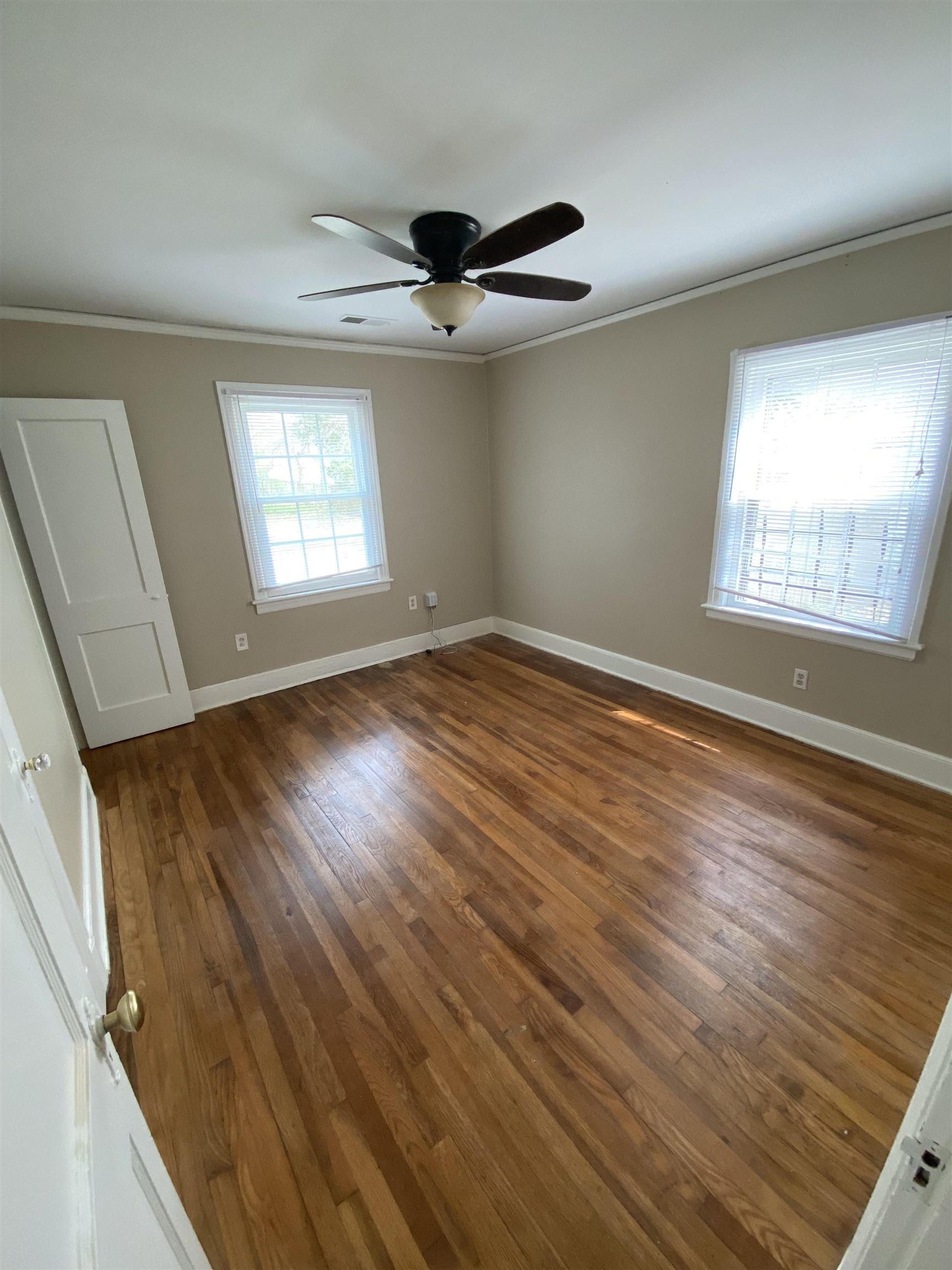 648 Loeb Street Memphis, TN 38111 - Photo 10 of 18 a view of an empty room with wooden floor and a window