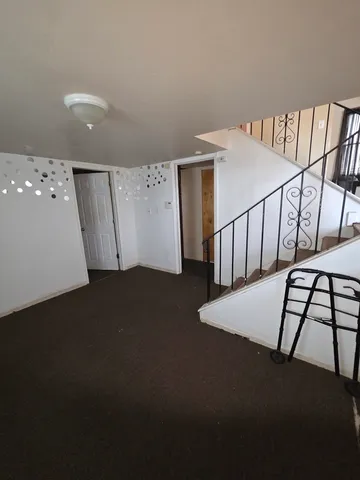 a kitchen with a stove a sink and a microwave