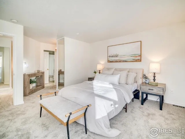 a bedroom with a bed and a table