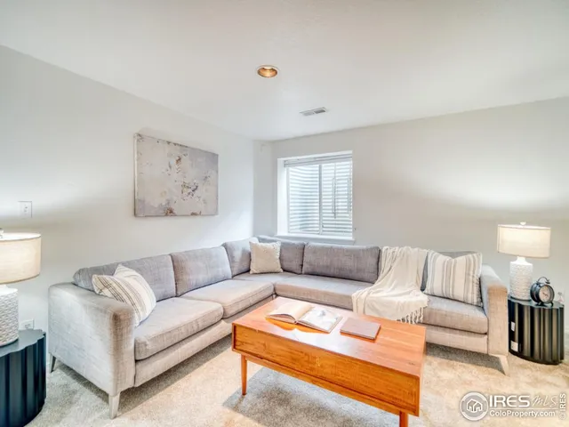 a living room with furniture and a couch
