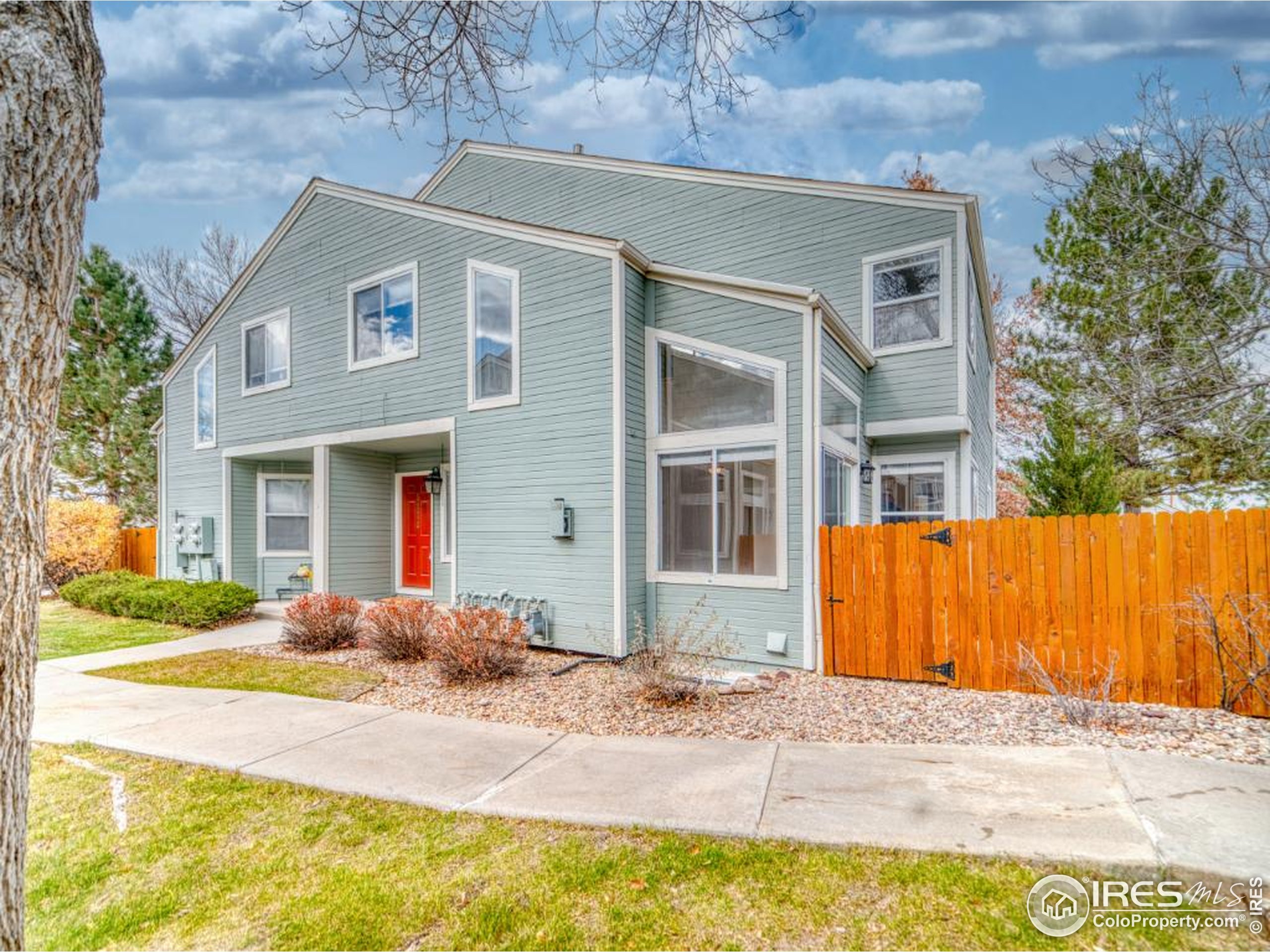 5174 Buckingham Road Boulder, CO 80301 - Photo 26 of 29 a front view of a house with a yard and garage