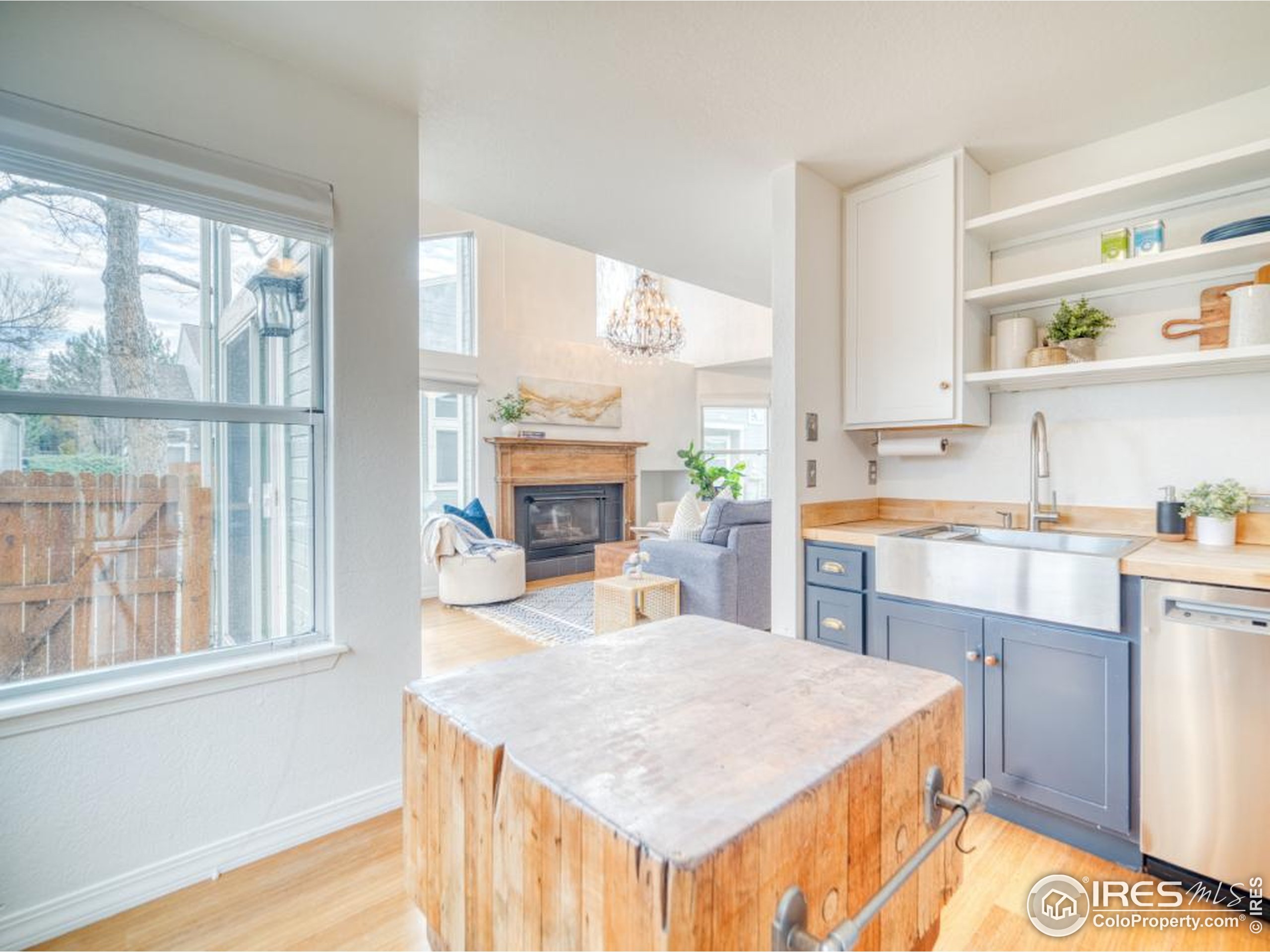 5174 Buckingham Road Boulder, CO 80301 - Photo 3 of 29 a kitchen with a stove a sink and a refrigerator