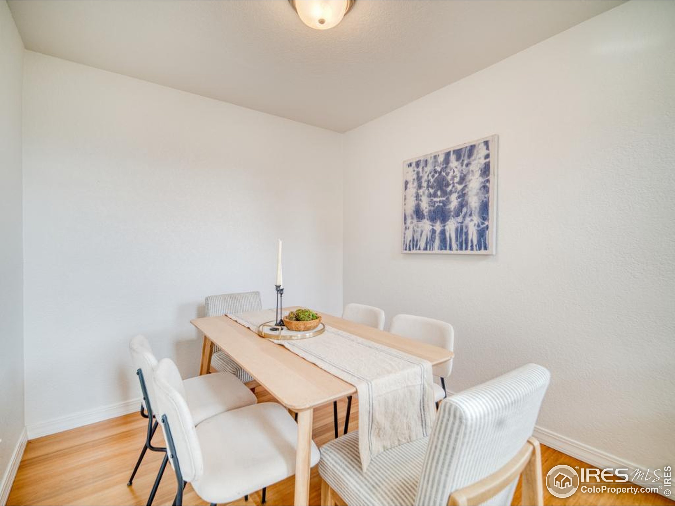 5174 Buckingham Road Boulder, CO 80301 - Photo 6 of 29 a view of a dining room with furniture and wooden floor