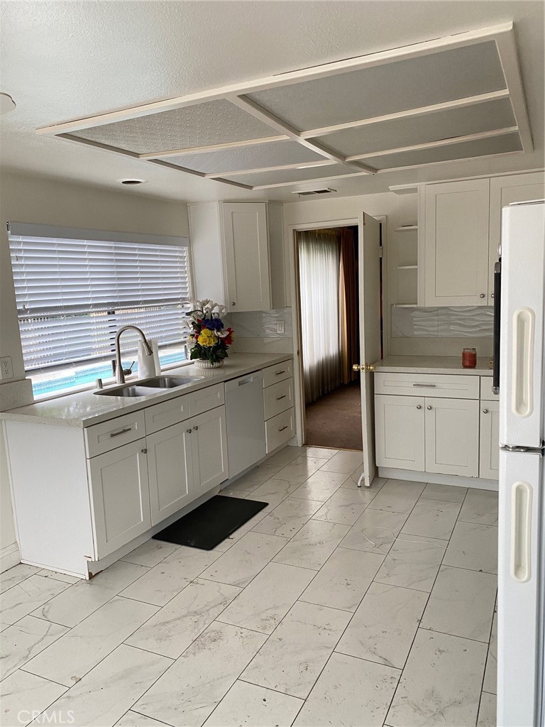 3177 Hawkwood Road Diamond Bar, CA 91765 - Photo 12 of 21 a kitchen with white cabinets and sink