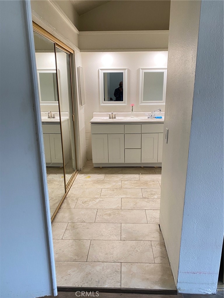 3177 Hawkwood Road Diamond Bar, CA 91765 - Photo 17 of 21 a bathroom with a sink and a mirror