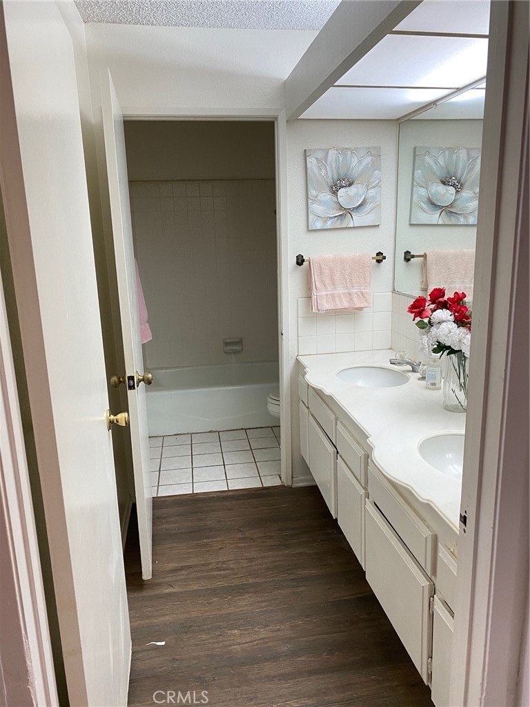 3177 Hawkwood Road Diamond Bar, CA 91765 - Photo 19 of 21 a bathroom with a sink a vanity and a tub