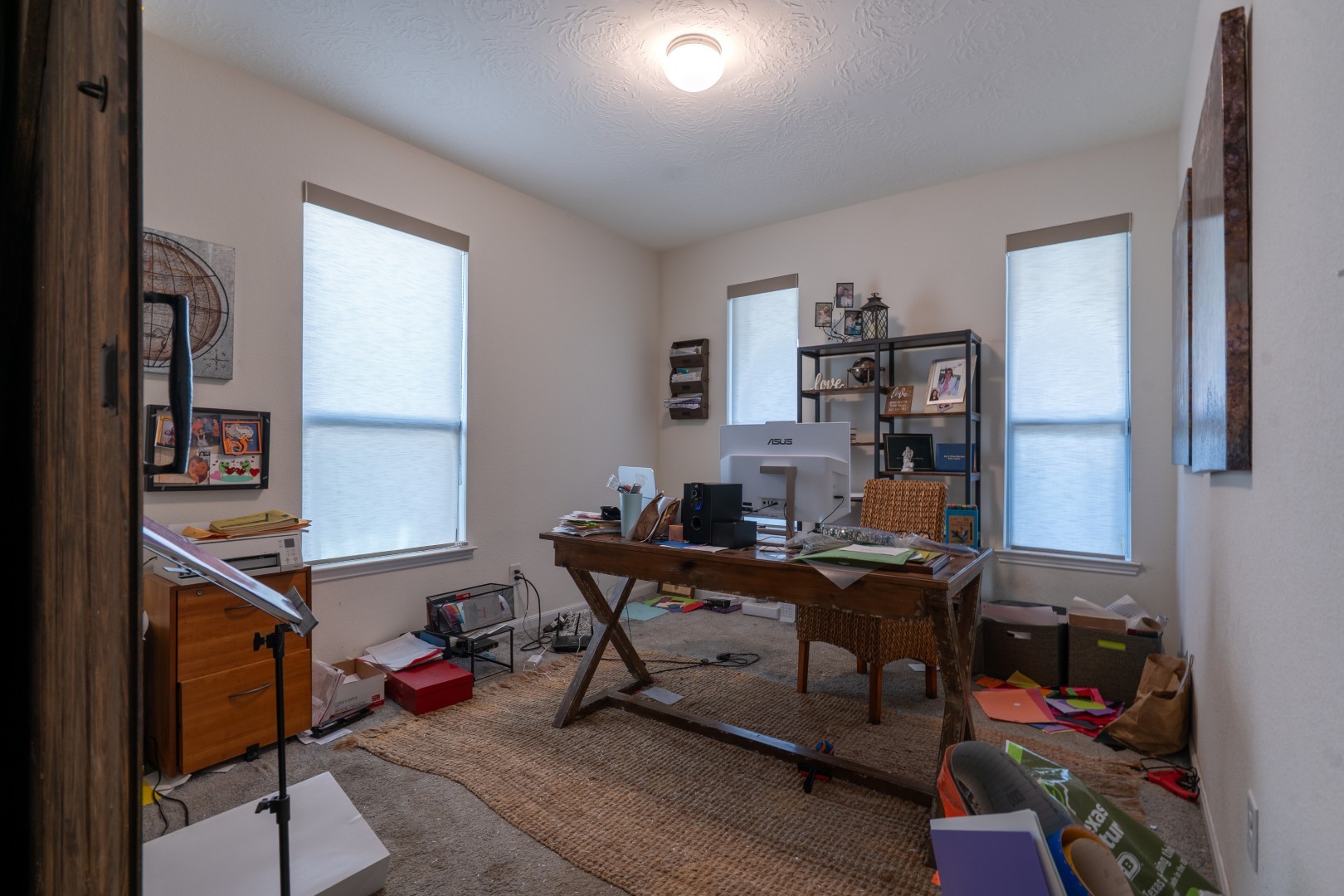 2003 Parnevik Place Conroe, TX 77304 - Photo 13 of 28 a view of a workspace with furniture and a window