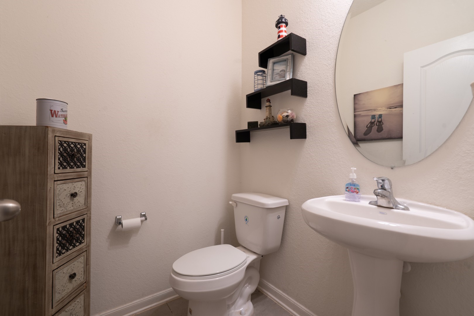 2003 Parnevik Place Conroe, TX 77304 - Photo 14 of 28 a bathroom with a toilet sink and mirror