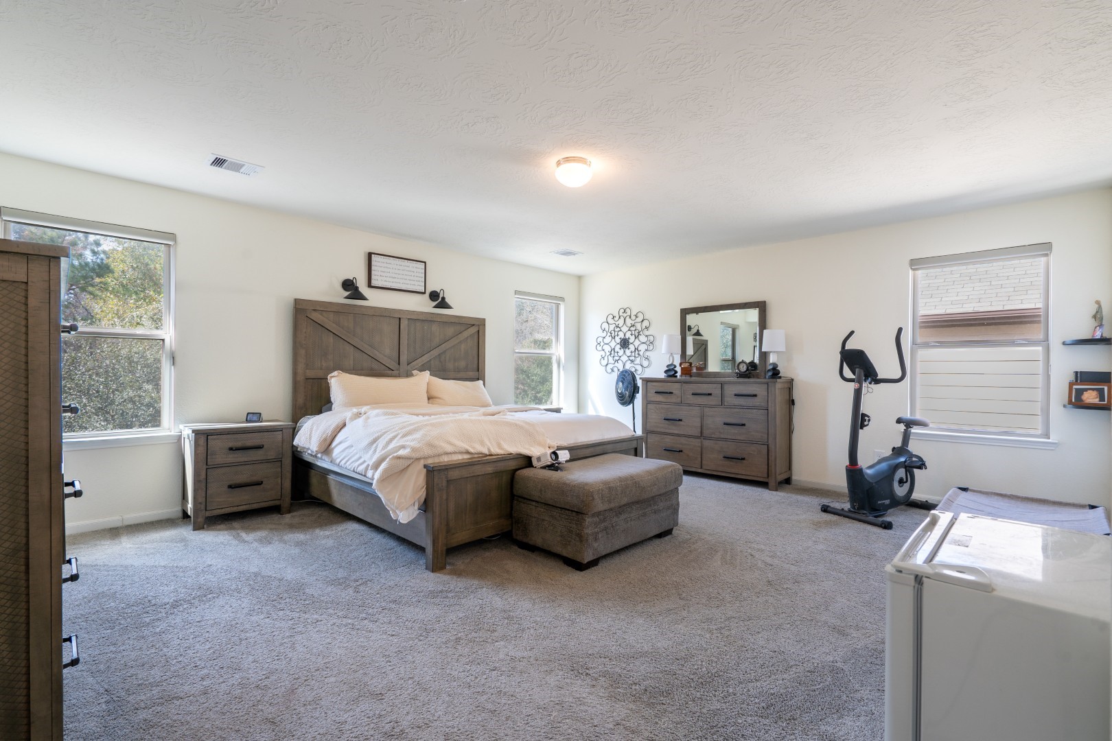 2003 Parnevik Place Conroe, TX 77304 - Photo 15 of 28 a bedroom with furniture and a window