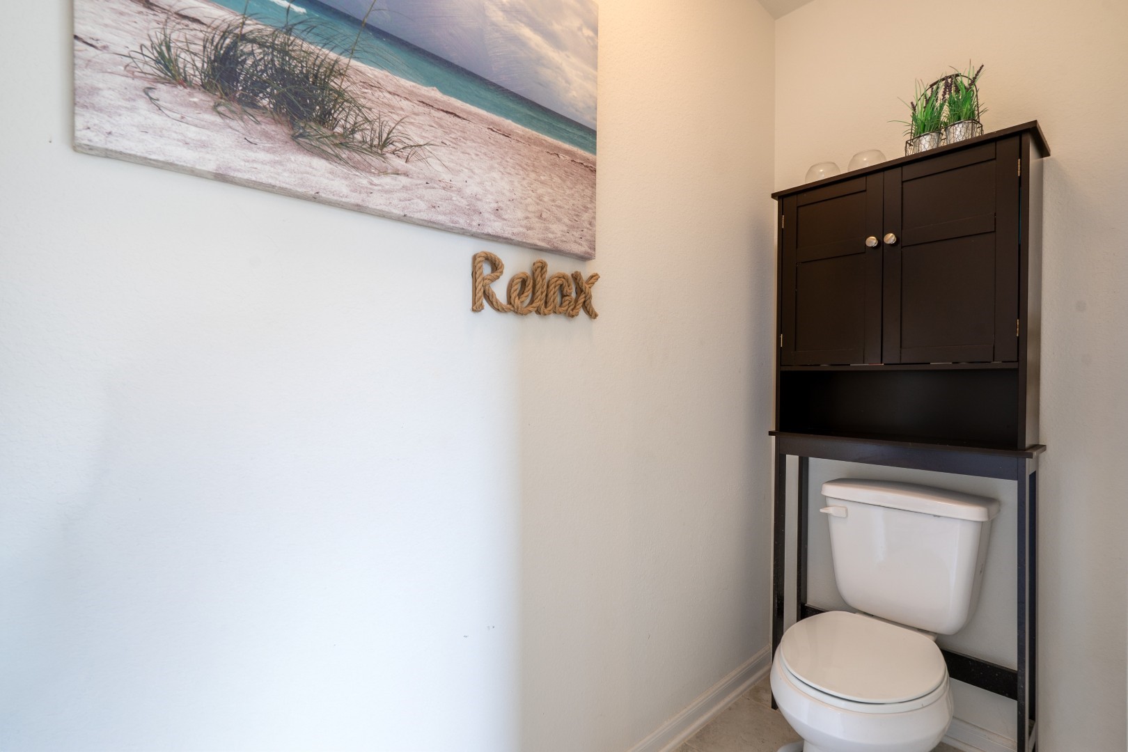 2003 Parnevik Place Conroe, TX 77304 - Photo 17 of 28 a white toilet sitting next to a shower curtain