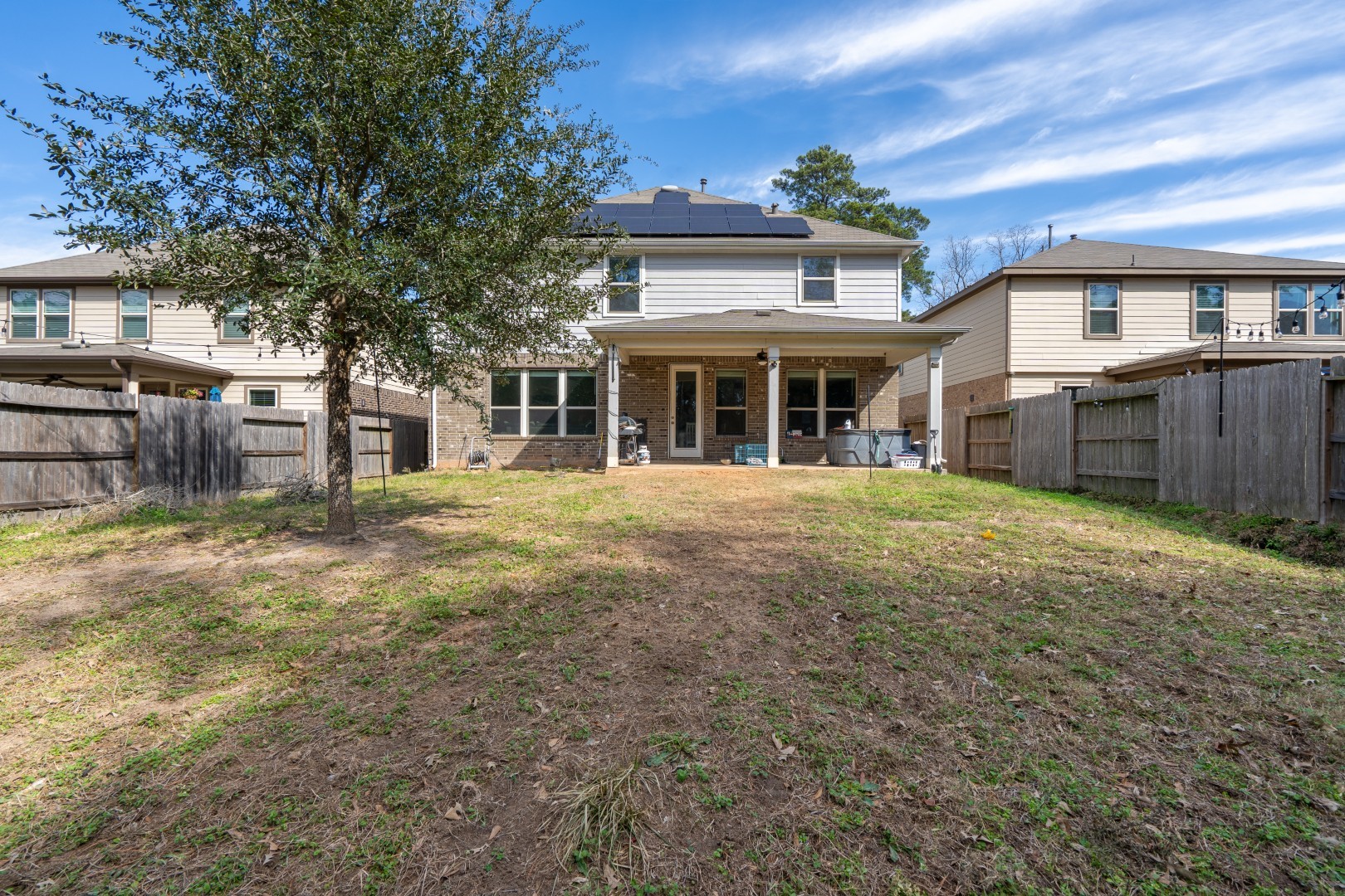 2003 Parnevik Place Conroe, TX 77304 - Photo 25 of 28 a view of a house with a yard