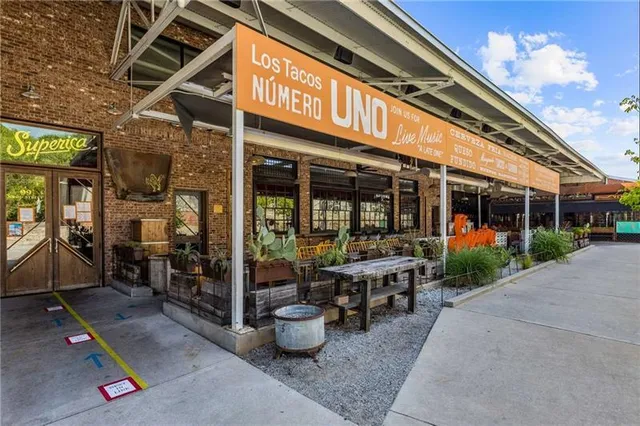 a view of a chairs and a table in the patio