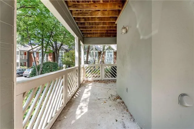 a view of a wooden door with a glass door