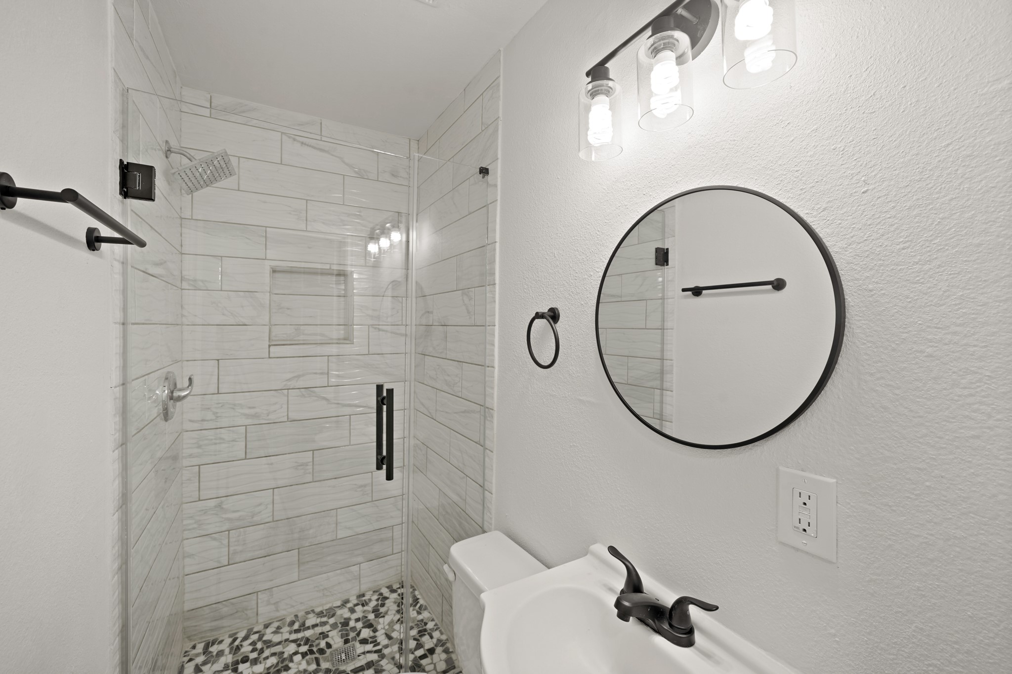 3501 Farmer Street Houston, TX 77020 - Photo 20 of 27 a bathroom with a sink a toilet and a mirror