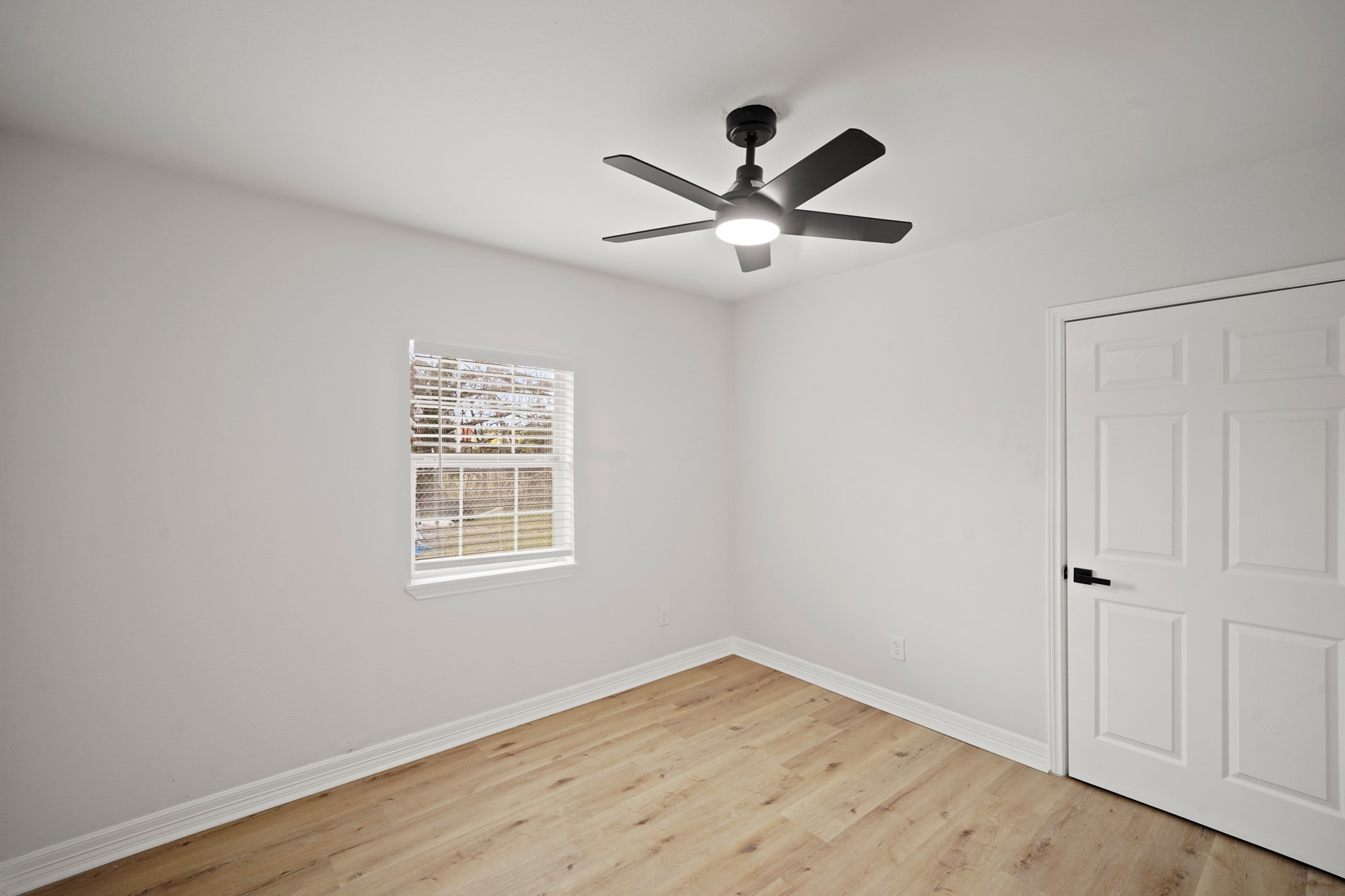 3501 Farmer Street Houston, TX 77020 - Photo 23 of 27 a view of empty room with wooden floor and fan