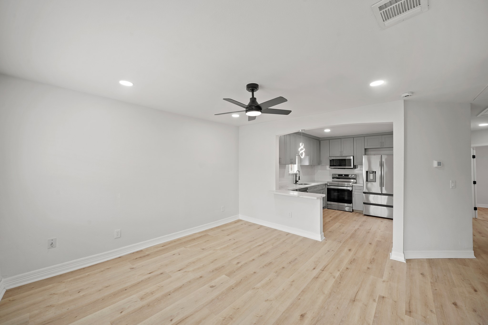 3501 Farmer Street Houston, TX 77020 - Photo 5 of 27 a view of a kitchen with a sink and a stove top oven