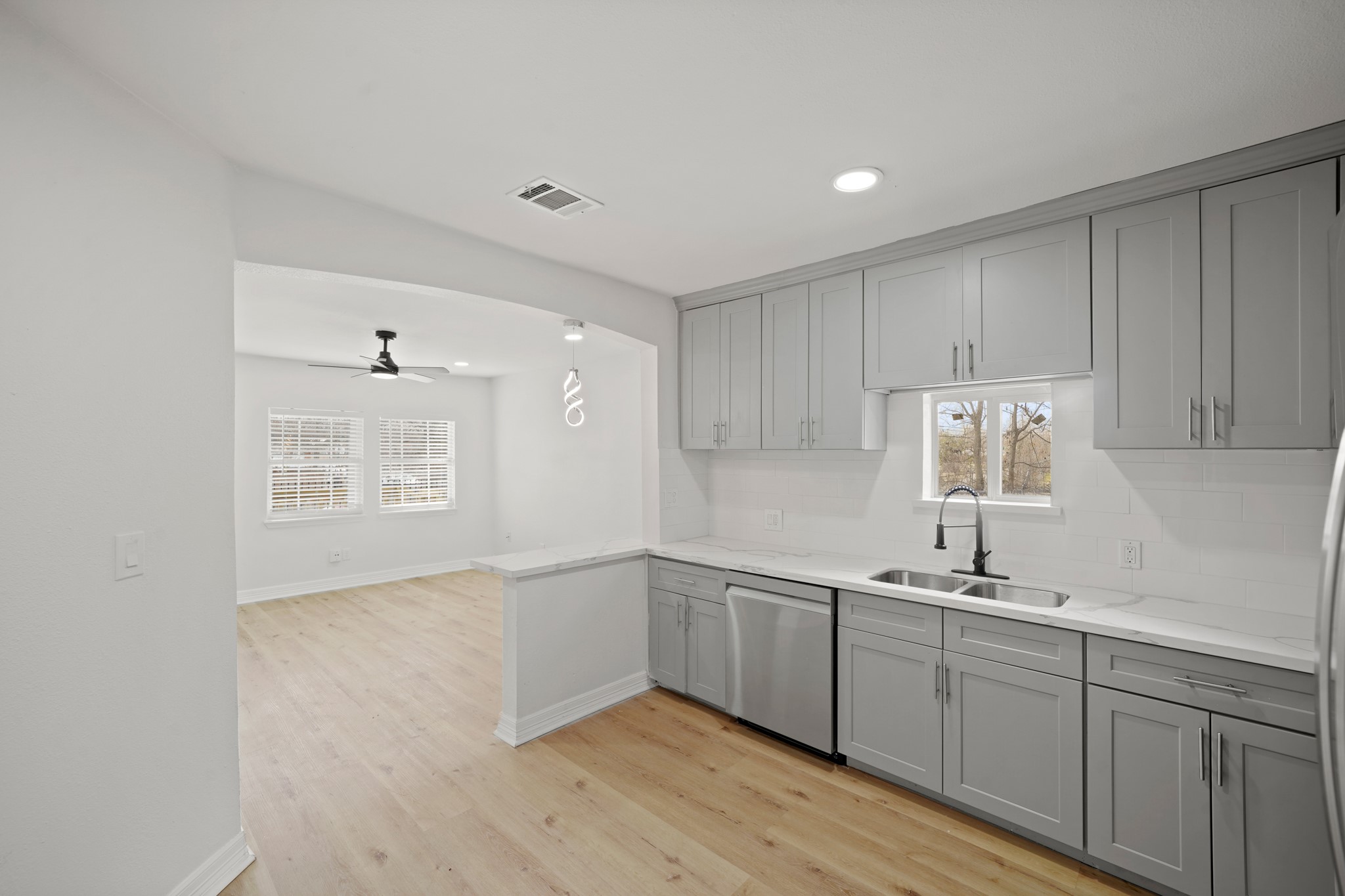 3501 Farmer Street Houston, TX 77020 - Photo 10 of 27 a kitchen with a sink cabinets and window