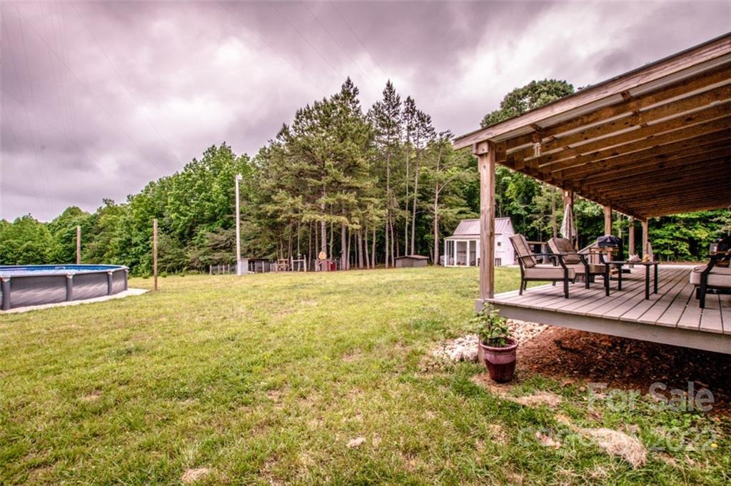 170 Houpe Road Cleveland, NC 27013 - Photo 19 of 48 a view of a swimming pool with a patio