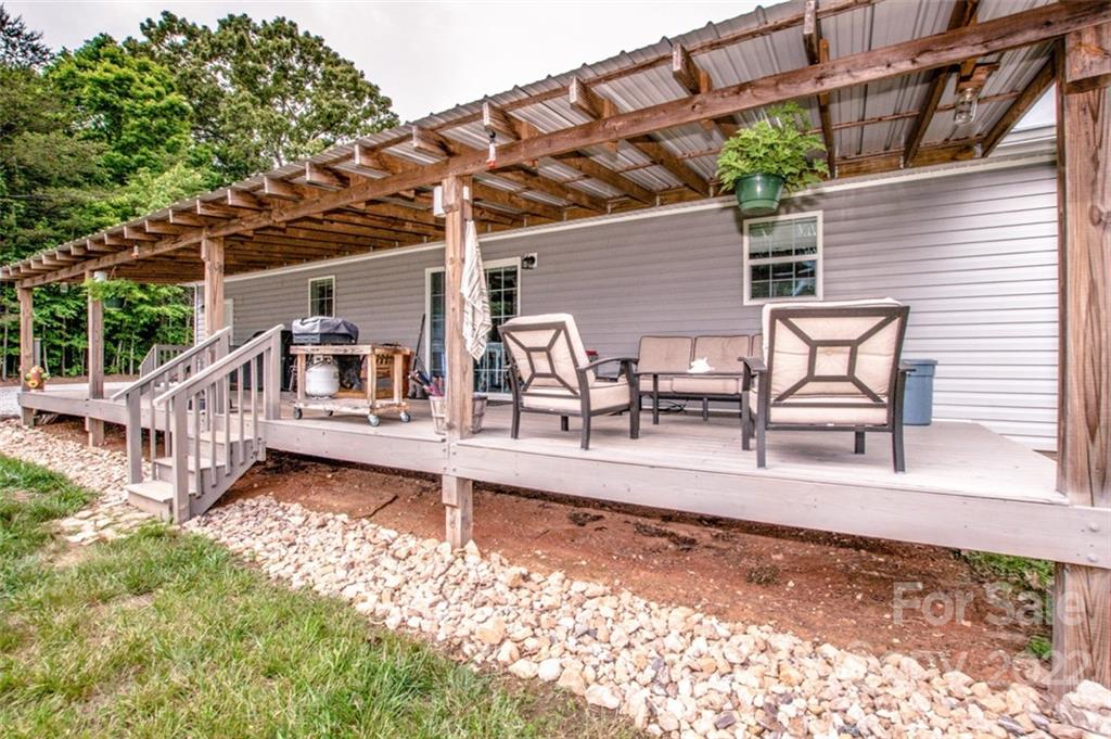 170 Houpe Road Cleveland, NC 27013 - Photo 23 of 48 a view of a house with backyard and sitting area