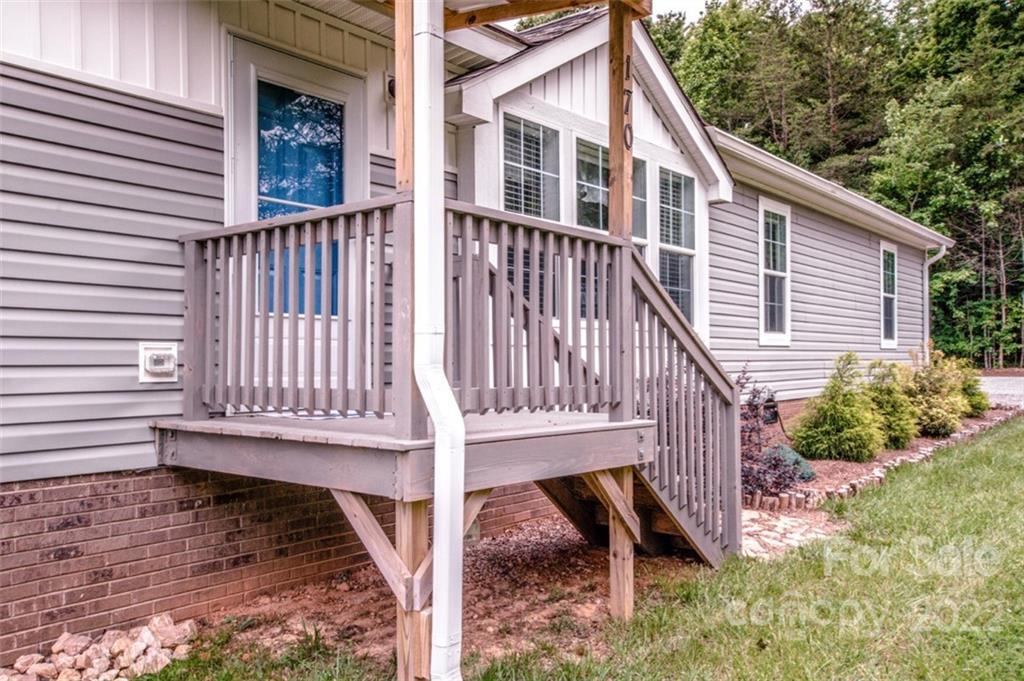 170 Houpe Road Cleveland, NC 27013 - Photo 3 of 48 a view of wooden house with a yard balcony