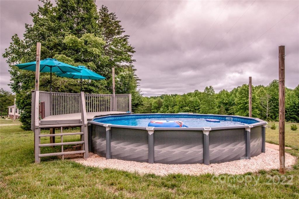 170 Houpe Road Cleveland, NC 27013 - Photo 8 of 48 a view of a backyard with wooden fence