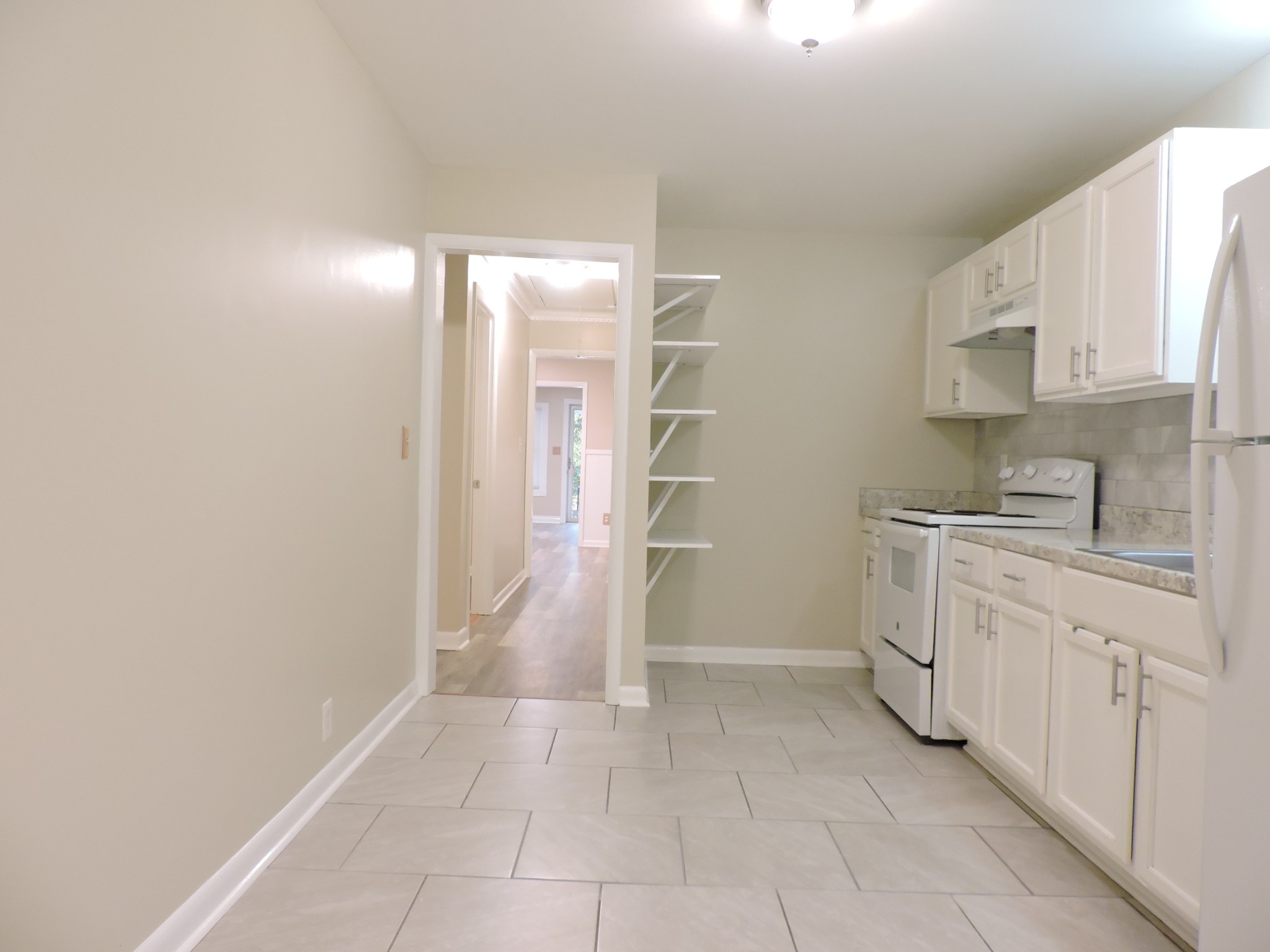 355 9th Avenue North, Unit B Franklin, TN 37064 - Photo 12 of 21 a view of a kitchen with white cabinets