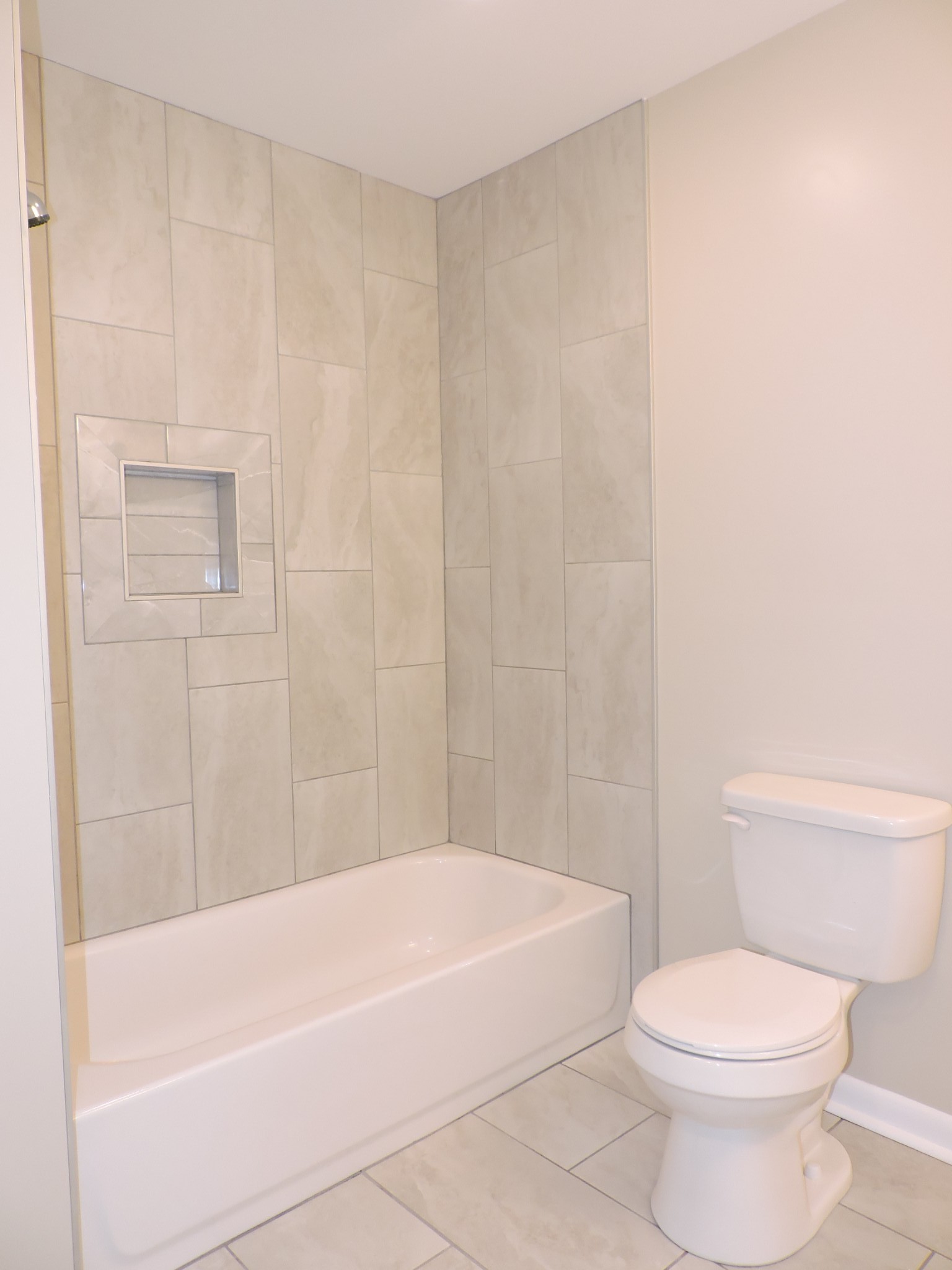 355 9th Avenue North, Unit B Franklin, TN 37064 - Photo 15 of 21 a white bath tub sitting next to a white toilet