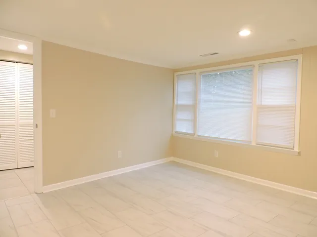 an empty room with a windows